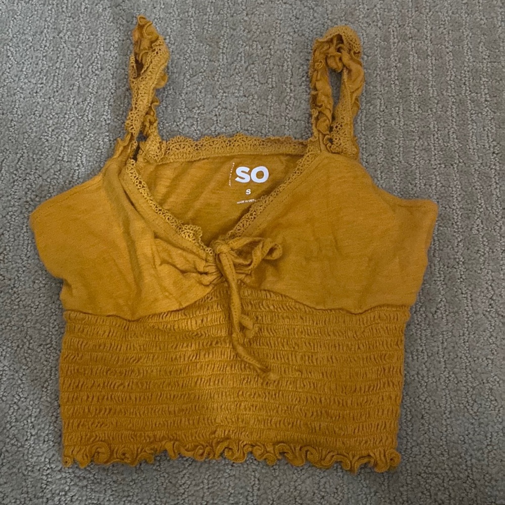 I’m selling a cropped SO shirt that is a orangey yellow color
